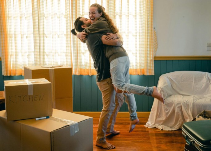 Couple moving in with boxes