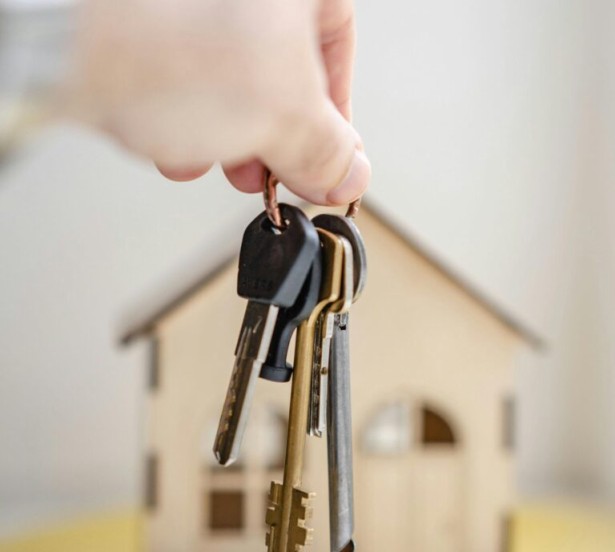 Keys in front of model home